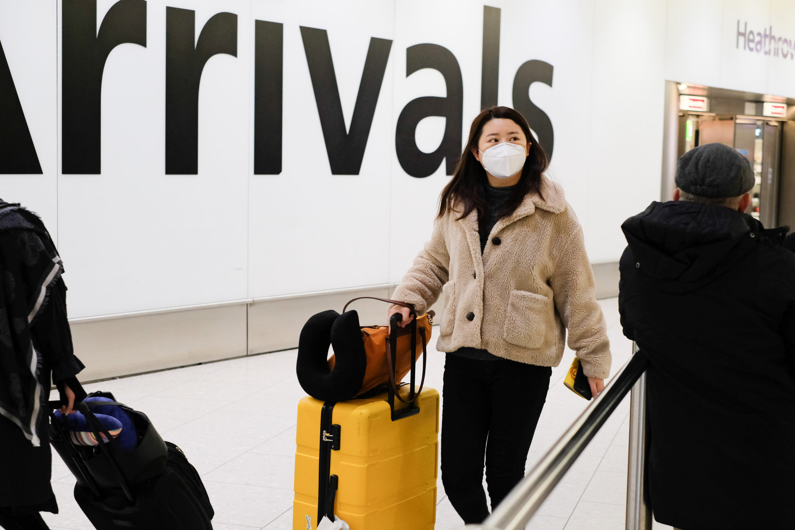 Heathrow Airport: Masked travellers arriving from China.