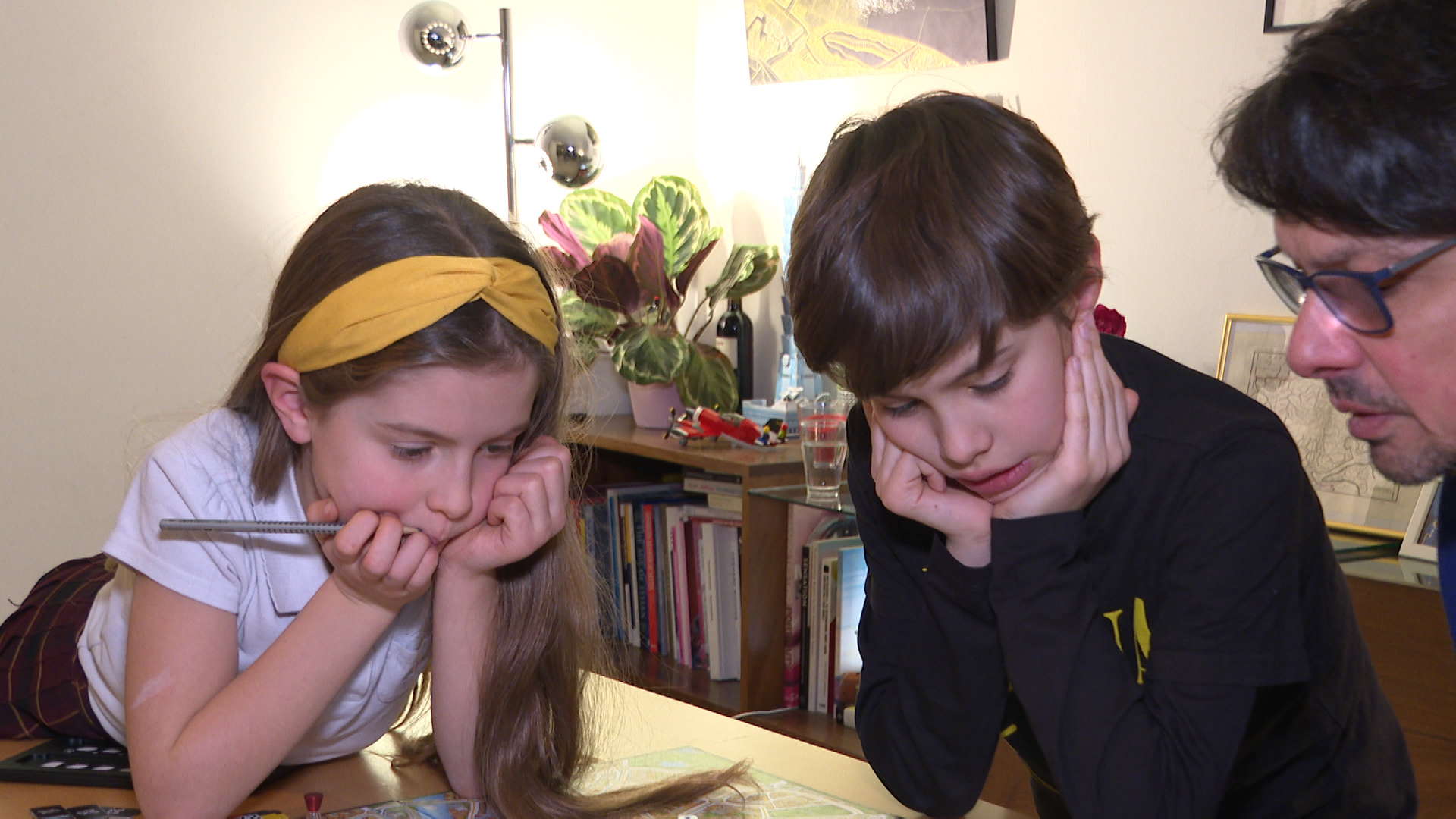 Old favourite: The children play a board game.