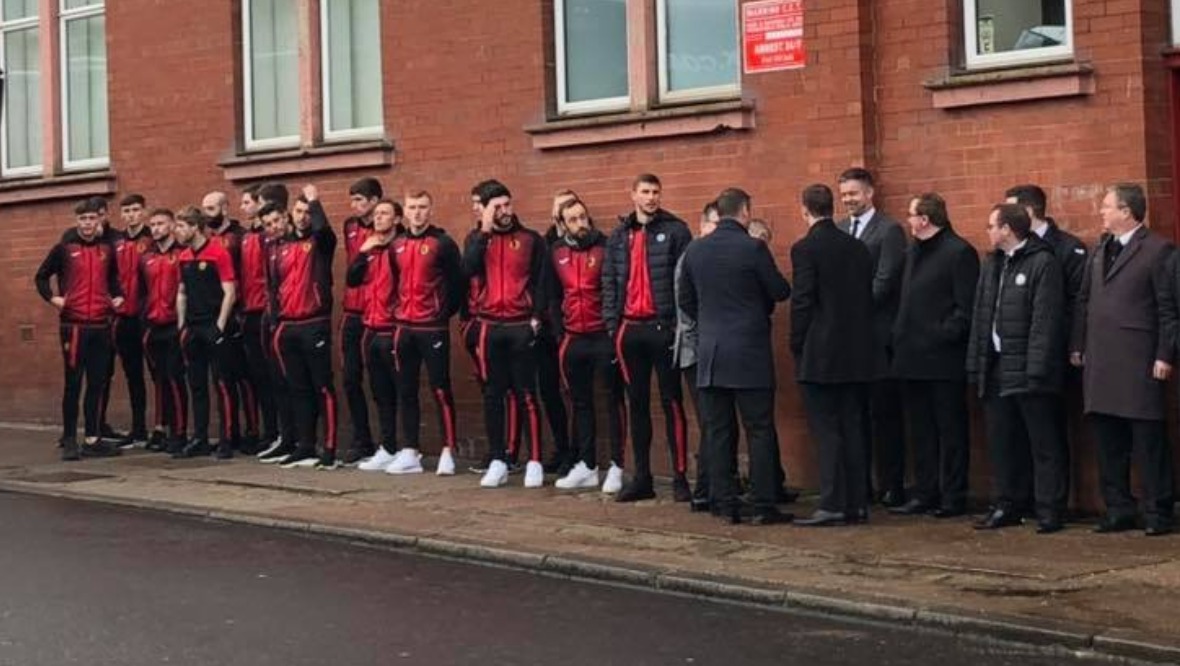 Partick Thistle players and officials pay their respects outside Firhill.