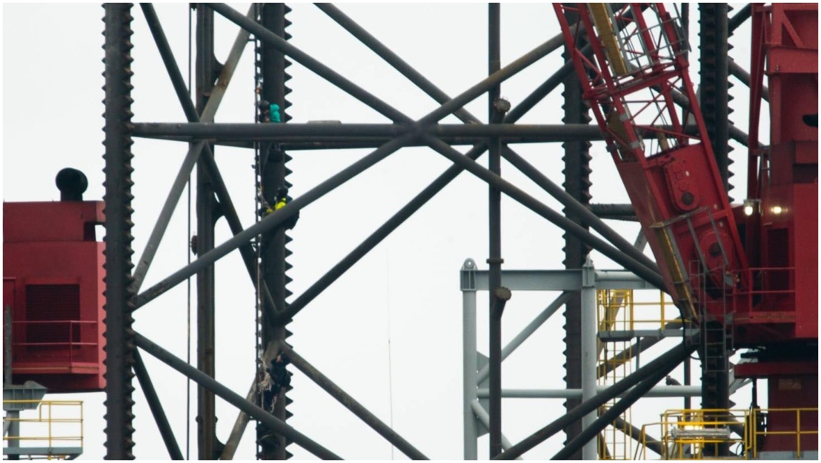 Extinction Rebellion: Three protesters scaled the rig. 