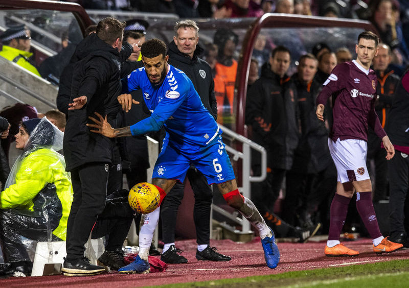 Tension: Connor Goldson is desperate to retrieve the ball during the match.