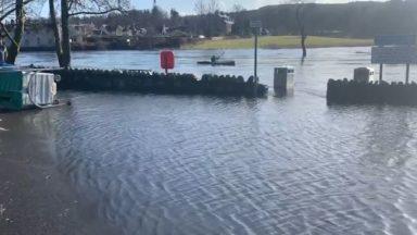 Man kayaks across flooded car park after heavy rain