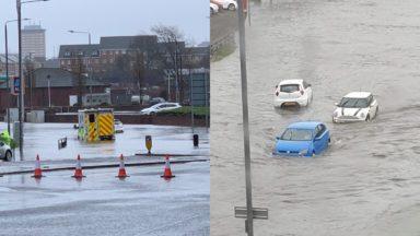 Torrential rain and high winds cause flooding and delays