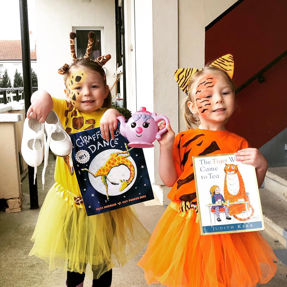  Freya dressed as Gerald from Giraffes Can’t Dance and Sophie as The Tiger Who Came To Tea 