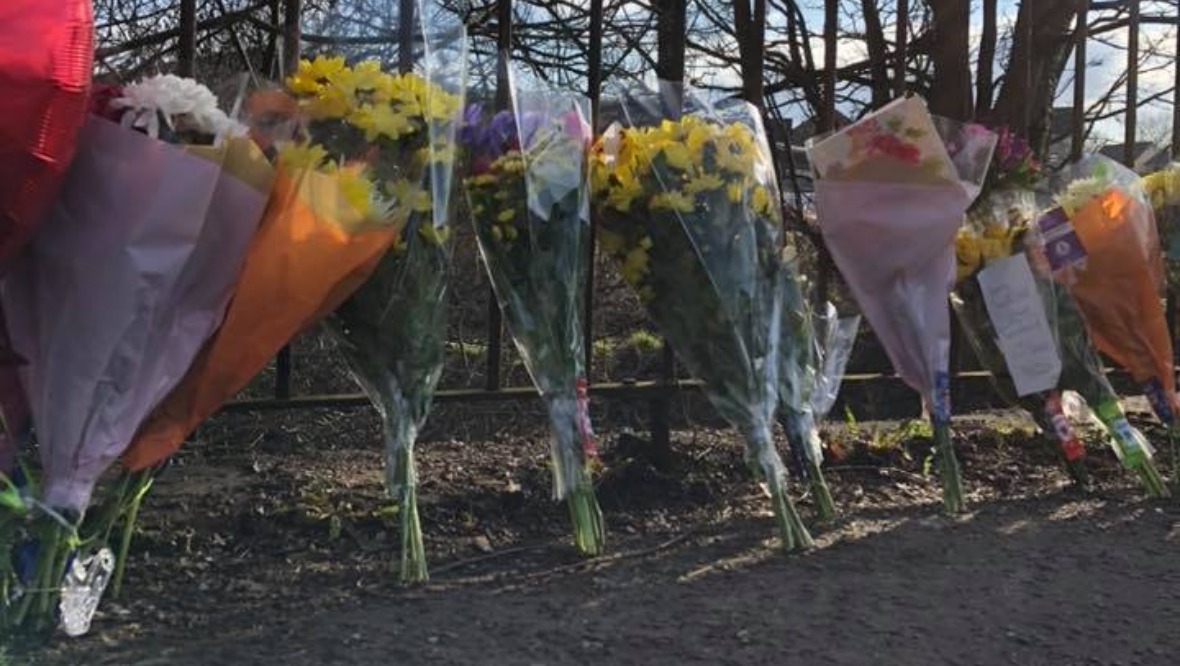Tribute: Flowers have been placed at the side of the road.