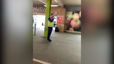Supermarket staff sing to entertain queuing  shoppers