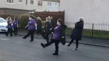 Group of carers break into dance to support key workers