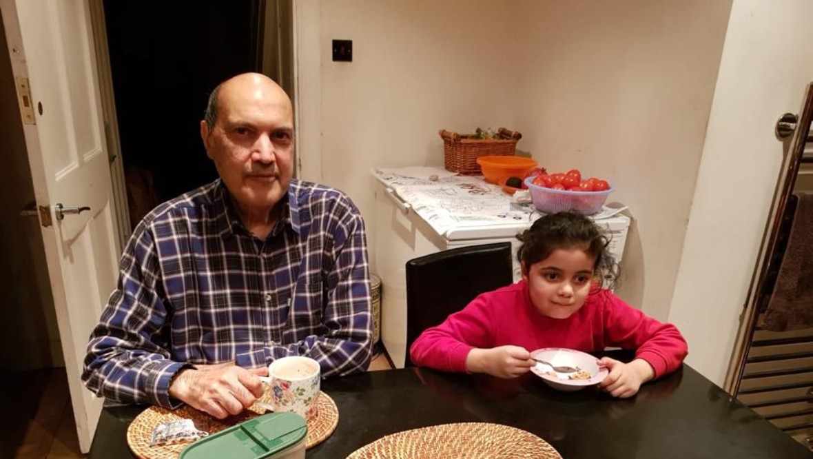  Waqar Hussian Chaudhry with his granddaughter.