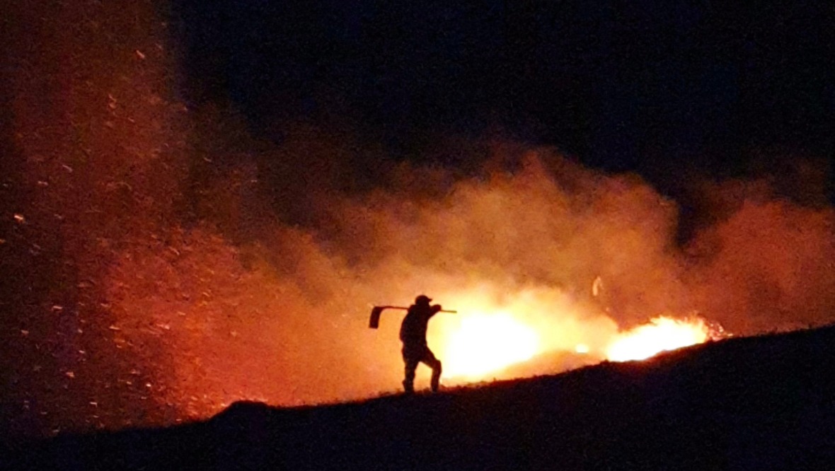 Wildfire: A gamekeeper fighting the blaze in Sutherland. 