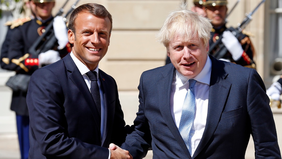 French President Emmanuel Macron with former prime minister Boris Johnson.