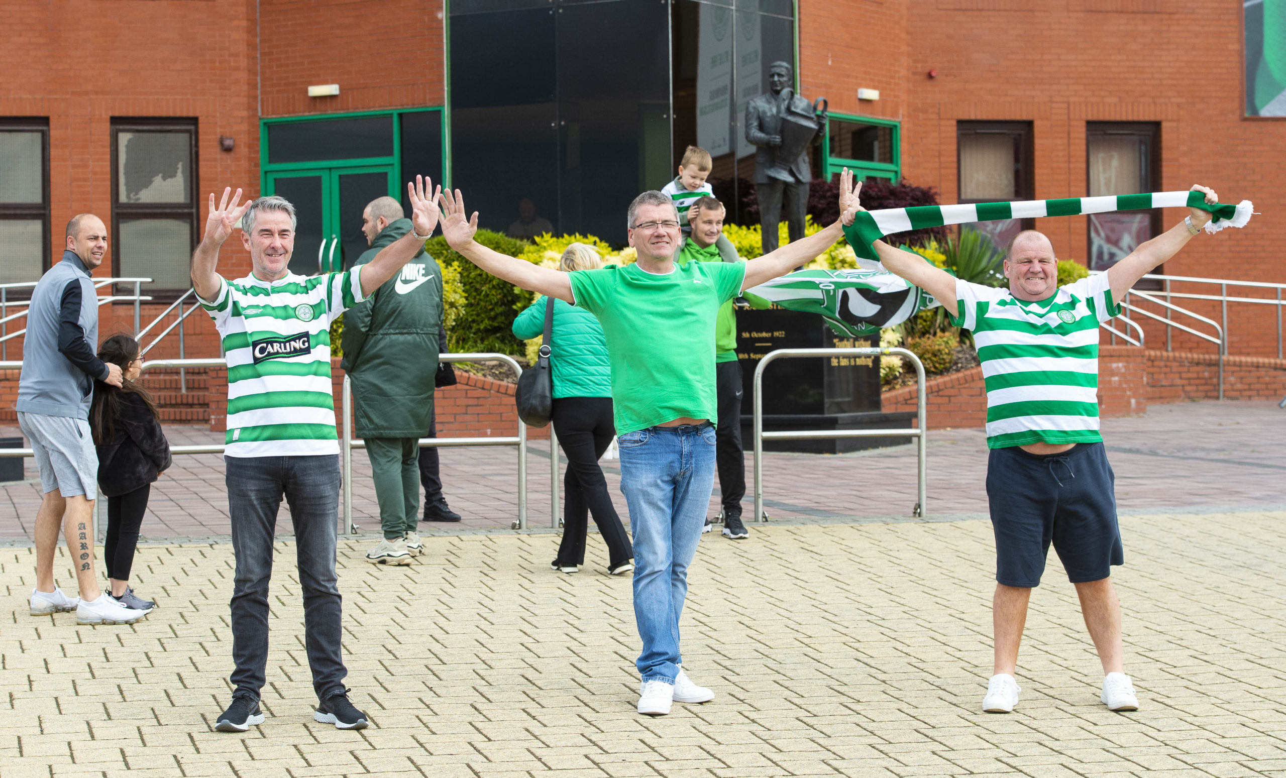 Celebrations: Celtic fans gather after title win. <strong>SNS</strong>” /><span class=