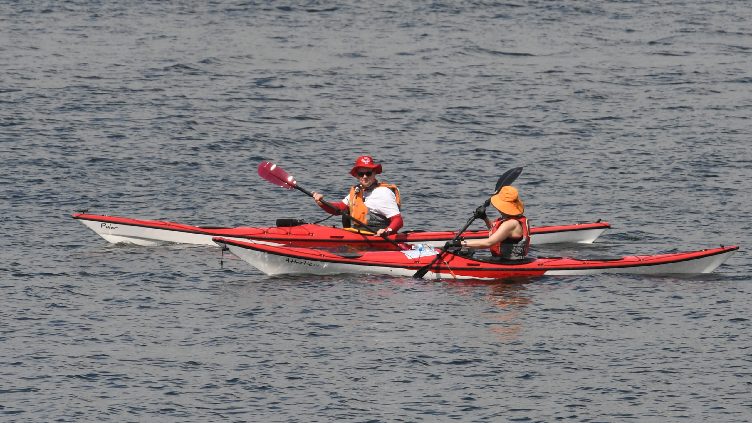 Paddling on: This couple cooled off in Gourock.