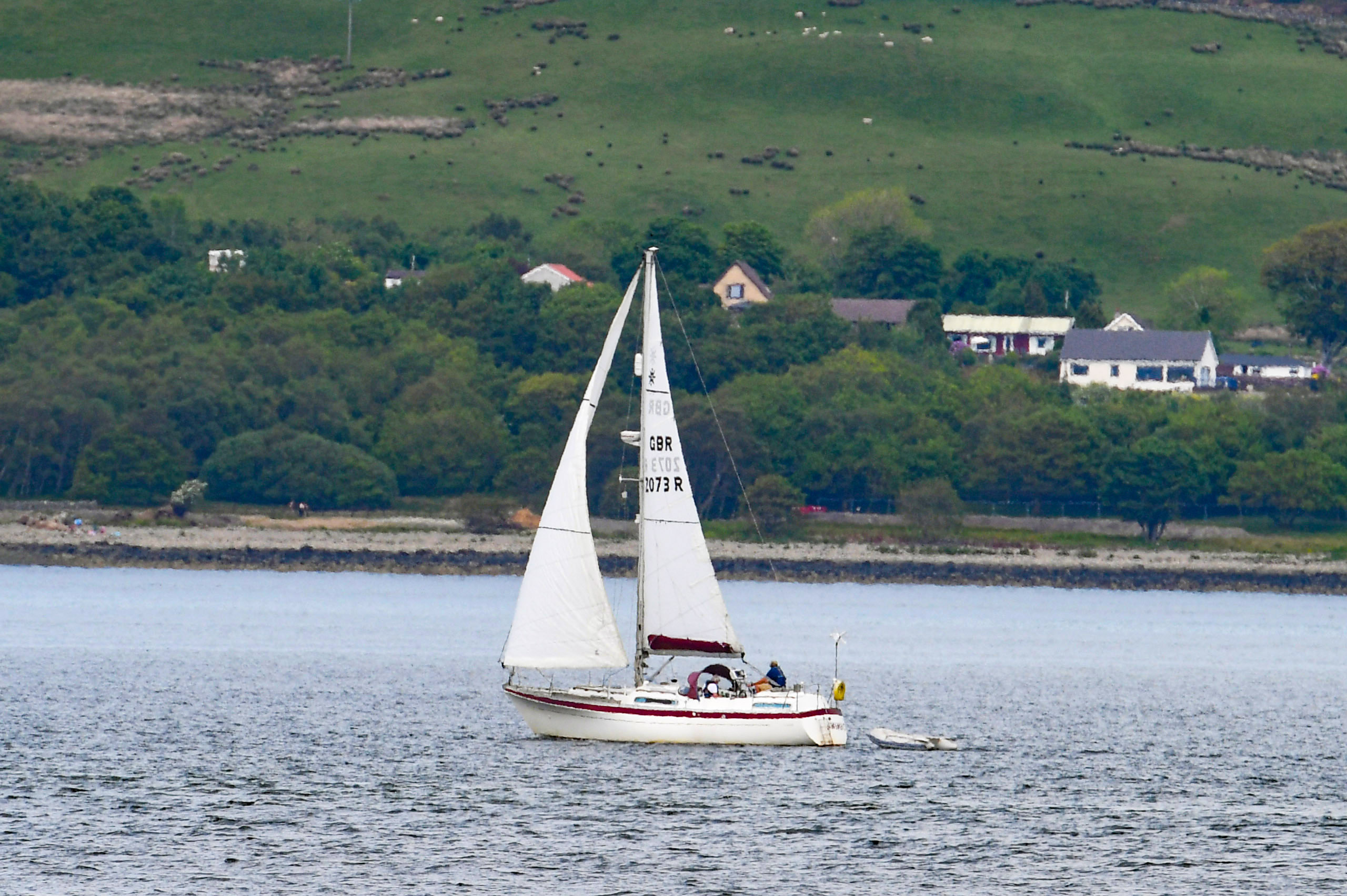 Sailing on: A yacht passed through Gourock Bay.