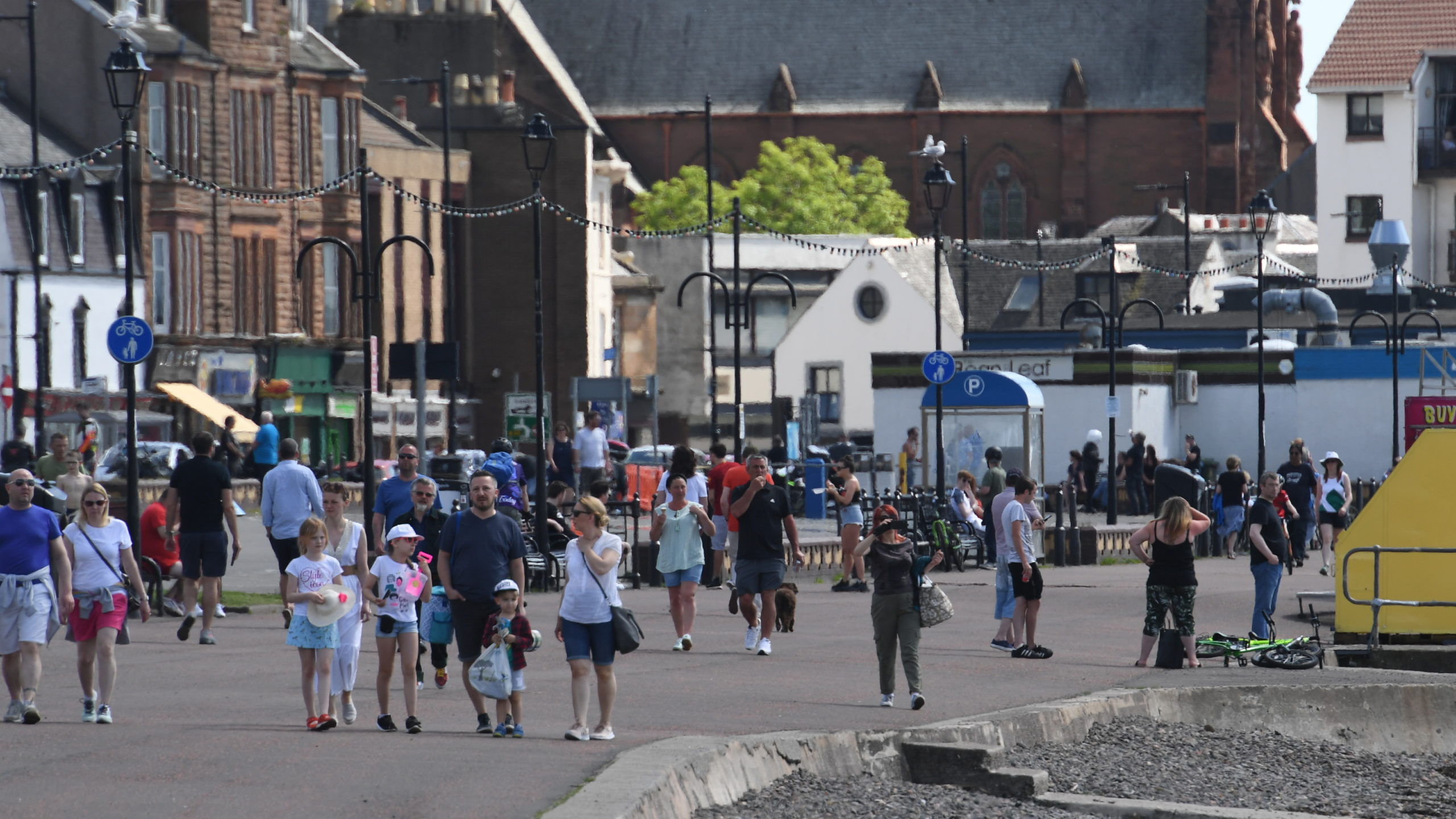 Beside the sea: Pedestrians took a walk down Largs waterfront.