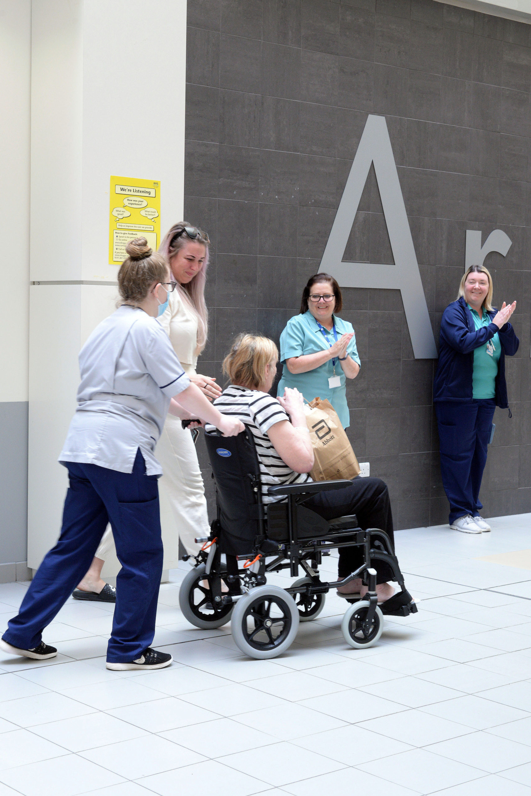 Ann leaves the Queen Elizabeth University Hospital in Glasgow. SWNS. 
