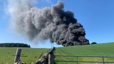 Fire crews tackle blaze at farm as public urged to stay away