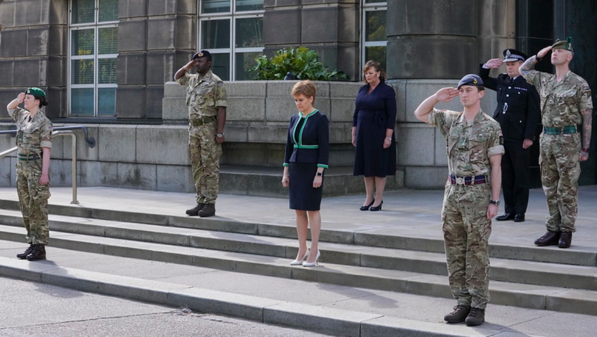 First Minister Nicola Sturgeon takes part in the minute's silence.