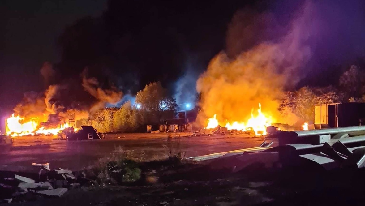 Two massive piles of rubbish on fire in industrial estate