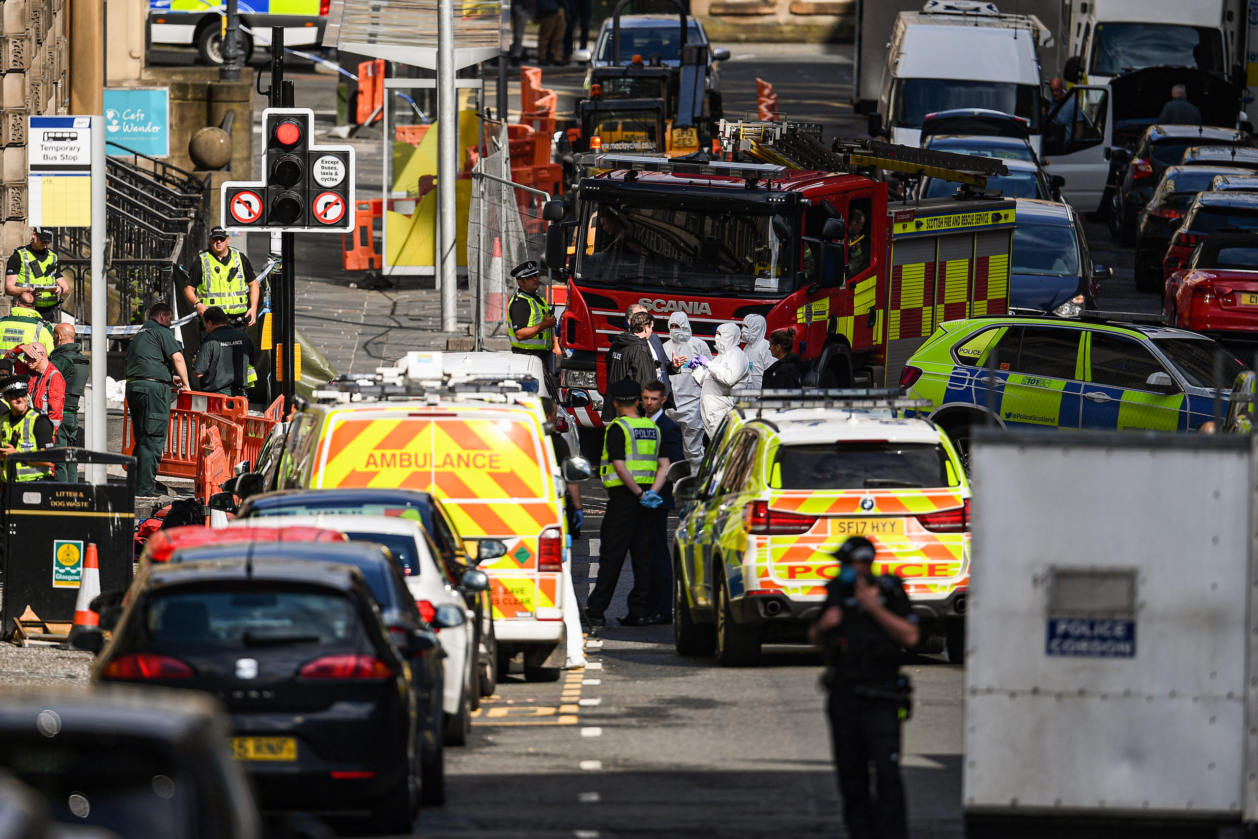 Police officers attend the scene after reports of three people being stabbed in a central Glasgow hotel on June 26, 2020.