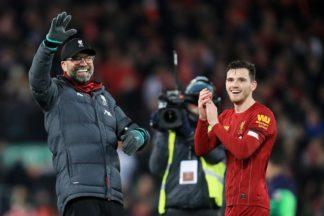 Andy Robertson celebrates after winning Premier League title