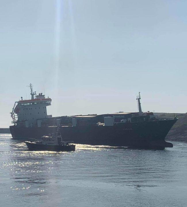 Investigation after cargo ship runs aground near harbour