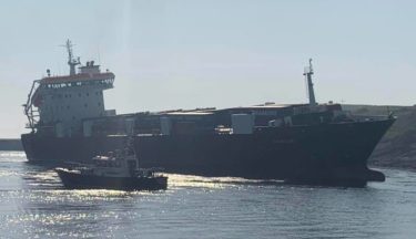 Investigation after cargo ship runs aground near harbour