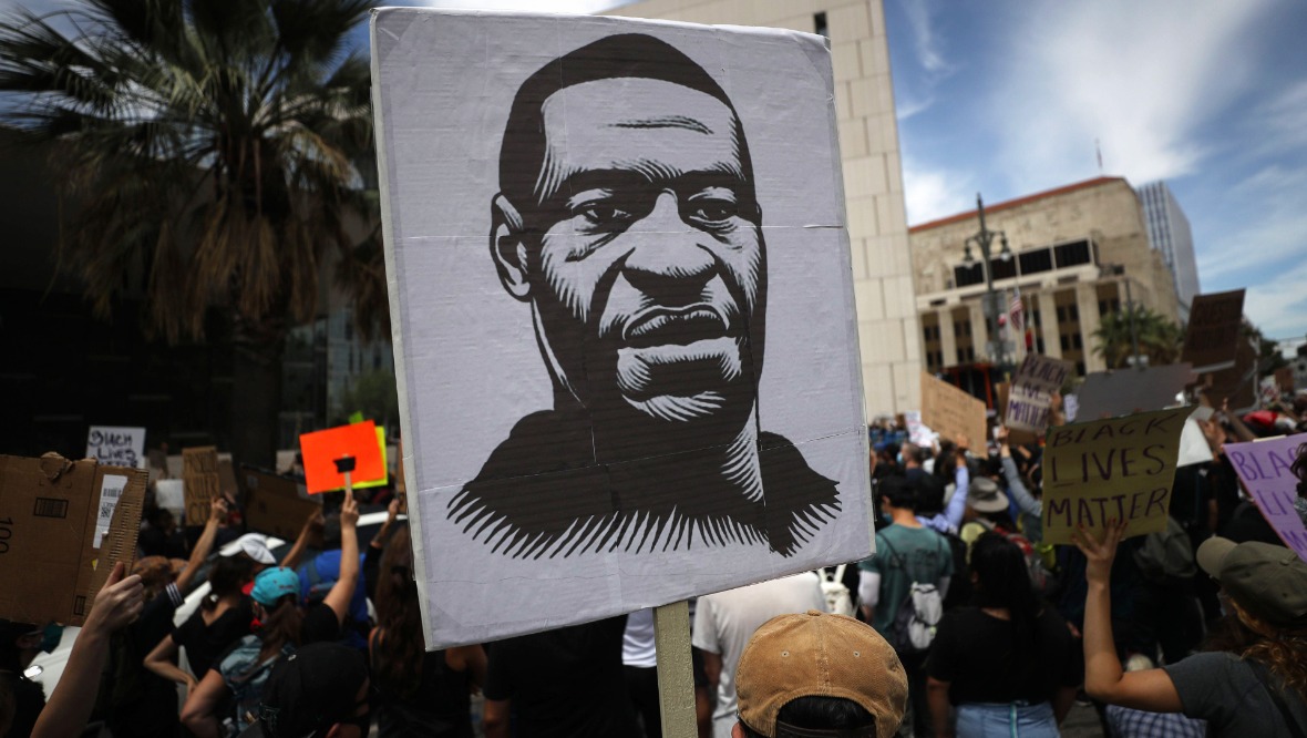 George Floyd poster held by Black Lives Matter protester in LA.