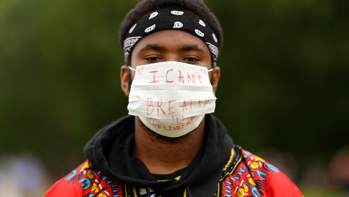 A Black Lives Matter protester pictured in London.<br><strong>Image Credit:</strong> Getty” /><span class=