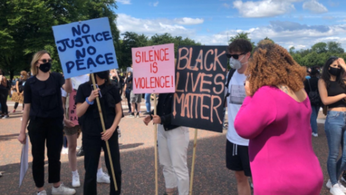 Signs: People pictured demonstrating in Glasgow. <strong>STV</strong>” /><span class=