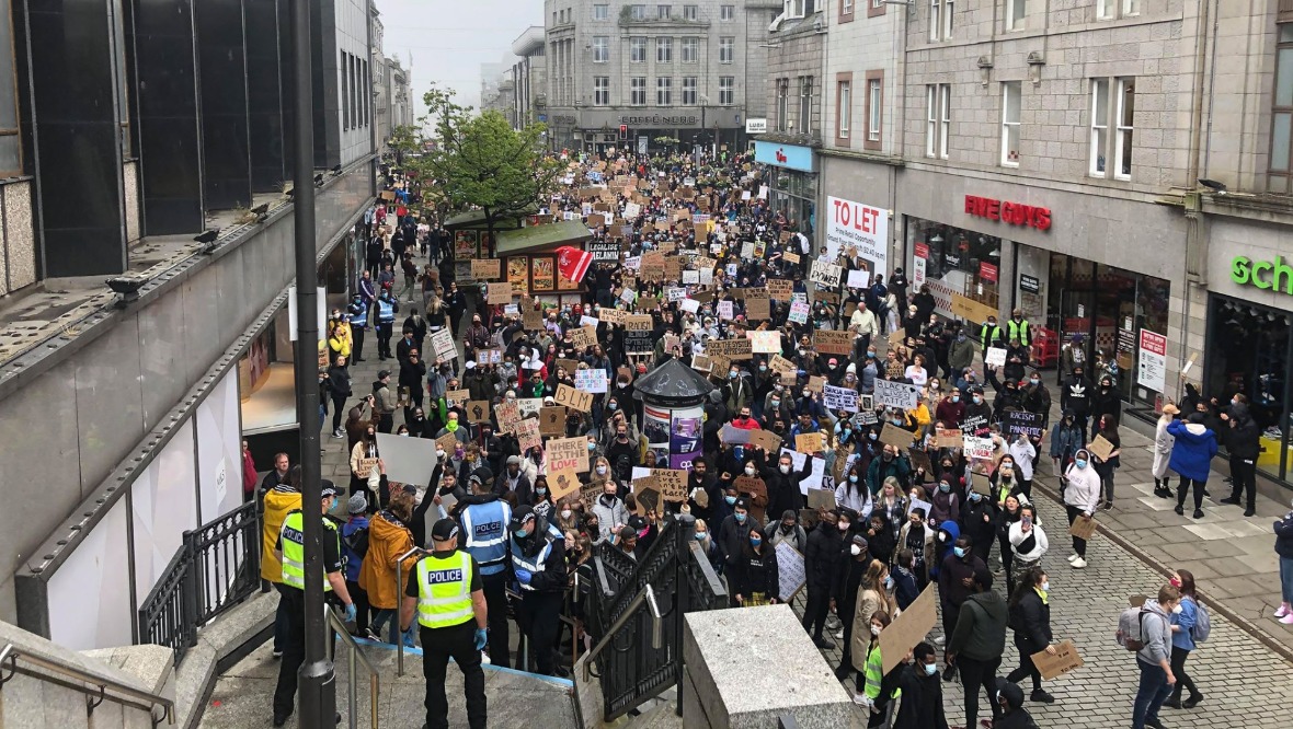 Protest: A crowd gathers in St Nicholas Street.