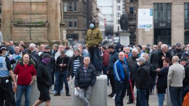 Crowds gather at George Square opposing planned protest