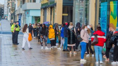 Huge queues as non-essential shops reopen for business