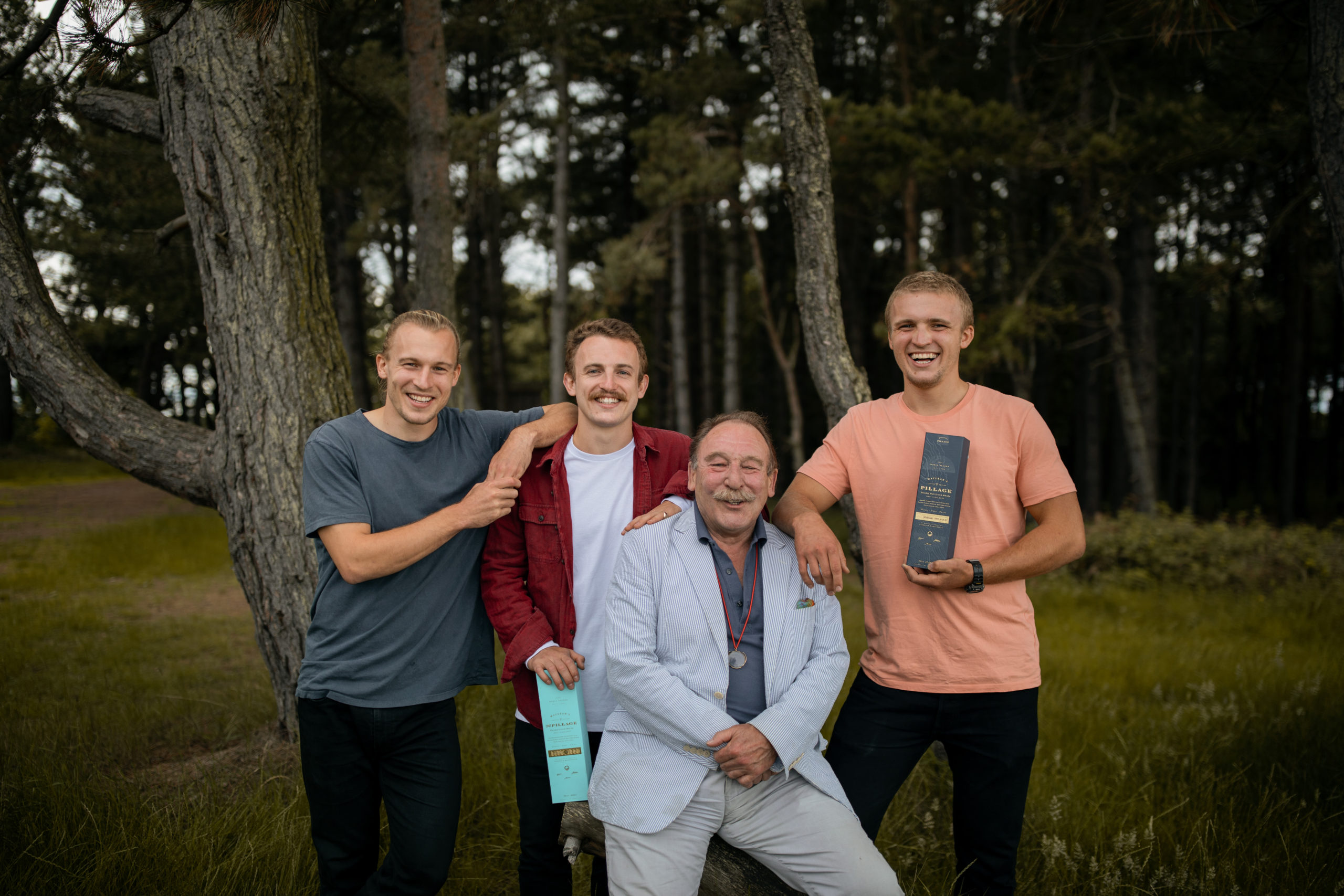 Family: The brothers with their dad, Charles.