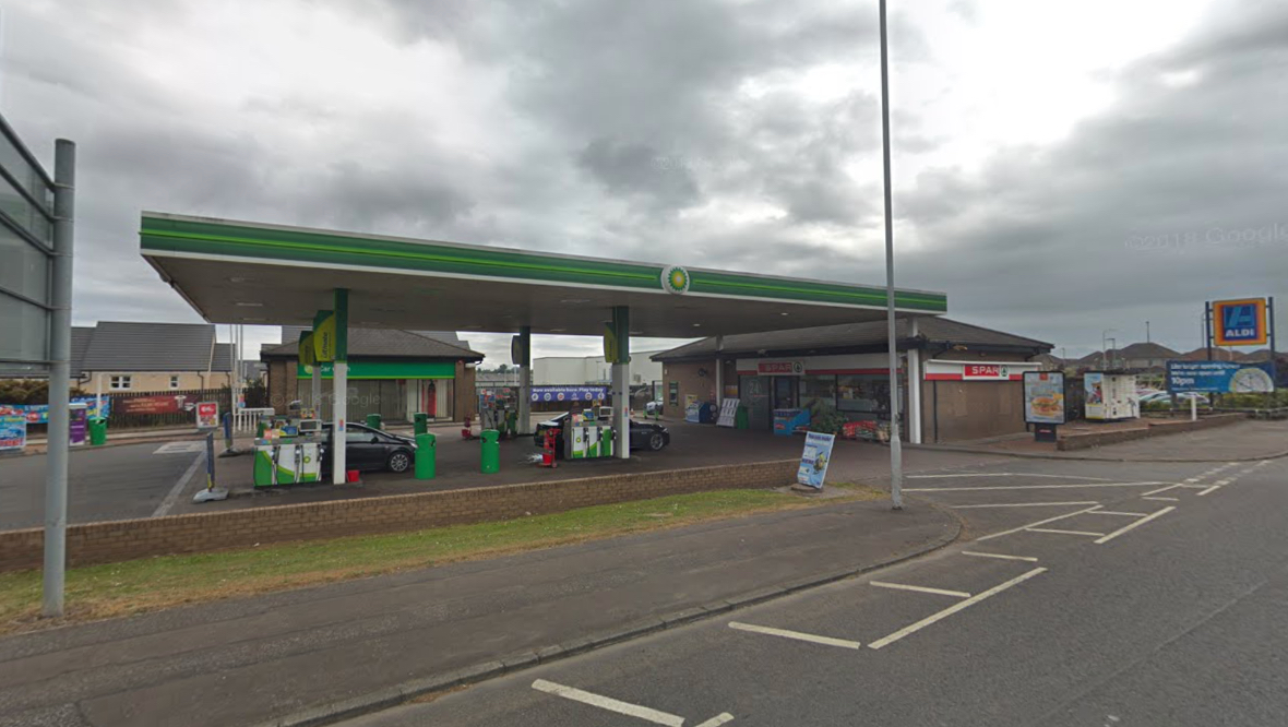 Manhunt after petrol station robbed and worker attacked