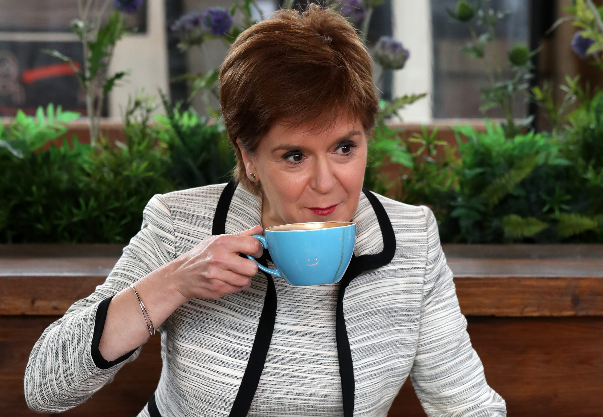 First Minister enjoys coffee as pavement cafes reopened on Monday. (Getty)