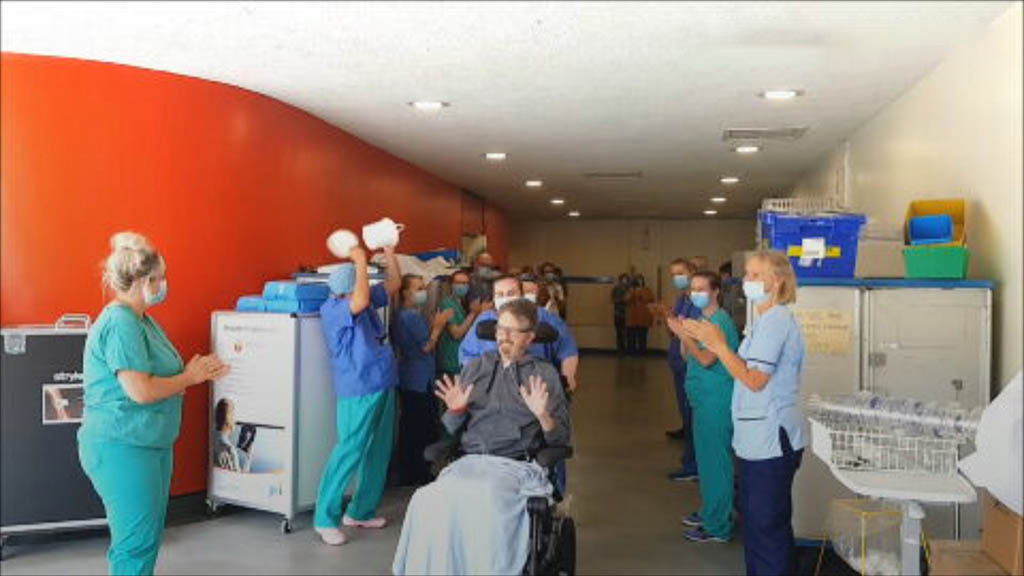 Applause: Ninewells staff applaud Grant as he leaves hospital