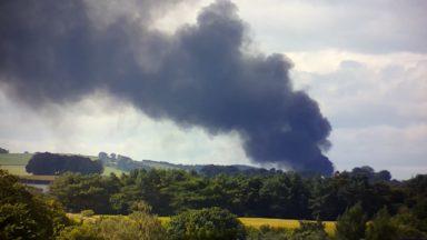 Smoke billows from industrial estate as crews tackle blaze