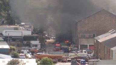 Crews still tackling industrial estate blaze 24 hours on