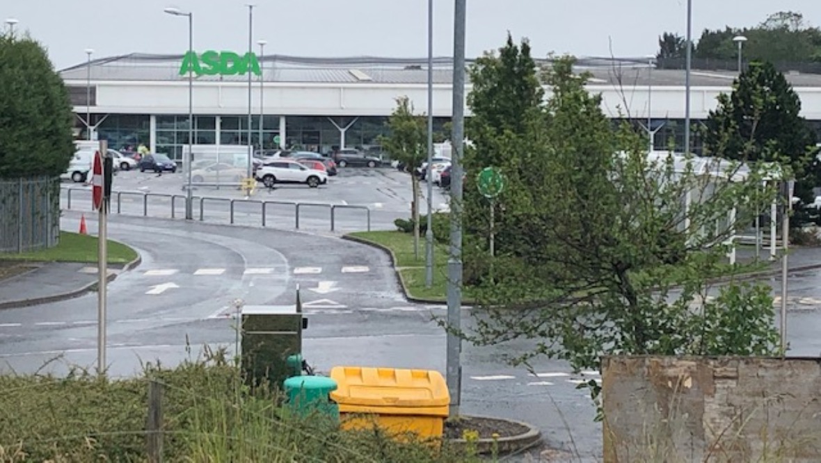 Man allegedly wielding axe forces Asda store to close