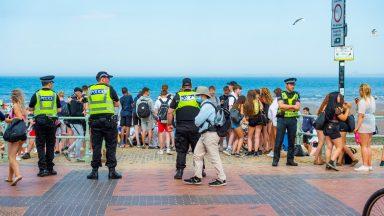 Police called to large disturbance on beach during heatwave