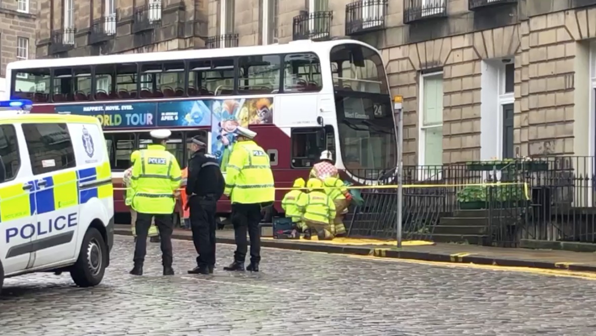 Crash: Firefighters begin recovery of bus. <strong>STV</strong>”/><cite class=cite>STV</cite></div><figcaption aria-hidden=true>Crash: Firefighters begin recovery of bus. <strong>STV</strong> <cite class=hidden>STV</cite></figcaption></figure><p>The street has been taped off, with fire engines, an ambulance and a number of police vehicles at the scene.</p><p>However, it is understood no one has been injured.</p><p>A spokeswoman said: “Police were called to South East Circus Place in the Stockbridge area of Edinburgh at around 6.55am on Monday, July 27, following a crash involving a double-decker bus.</p><p>“The road is currently closed at the Howe Street junction and officers remain on scene.”</p><div class=