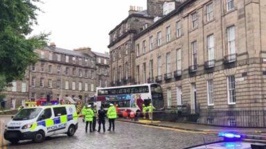 Double-decker bus veers off road and ploughs into building
