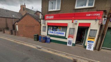 Hunt for axe-wielding robber who stole alcohol and tobacco