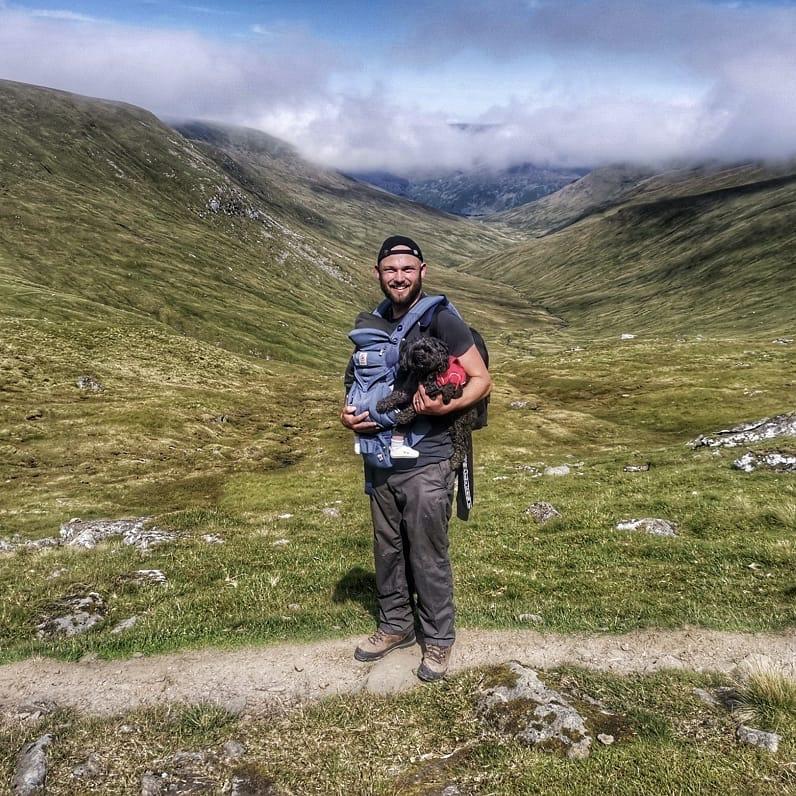 Dad Lee carries baby Innis to the summit. 