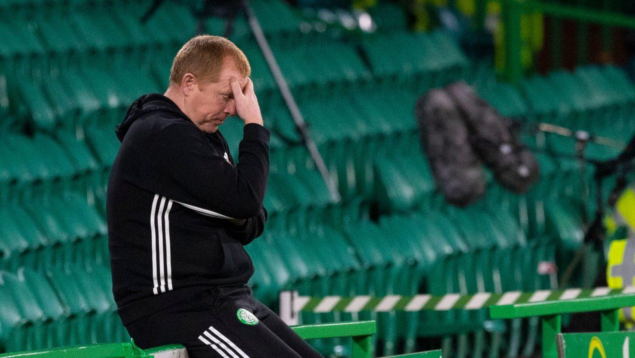Celtic manager Neil Lennon holiding his head in frustration as Celtic loses to Hungarian Ferencvaros side Ferencvaros to exit Champions League.