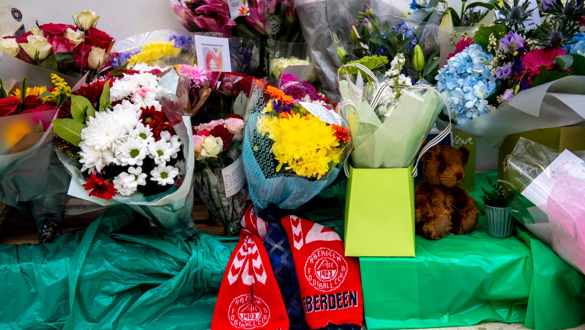 Tributes at Aberdeen train station to those who died in the crash. Pic: SNS