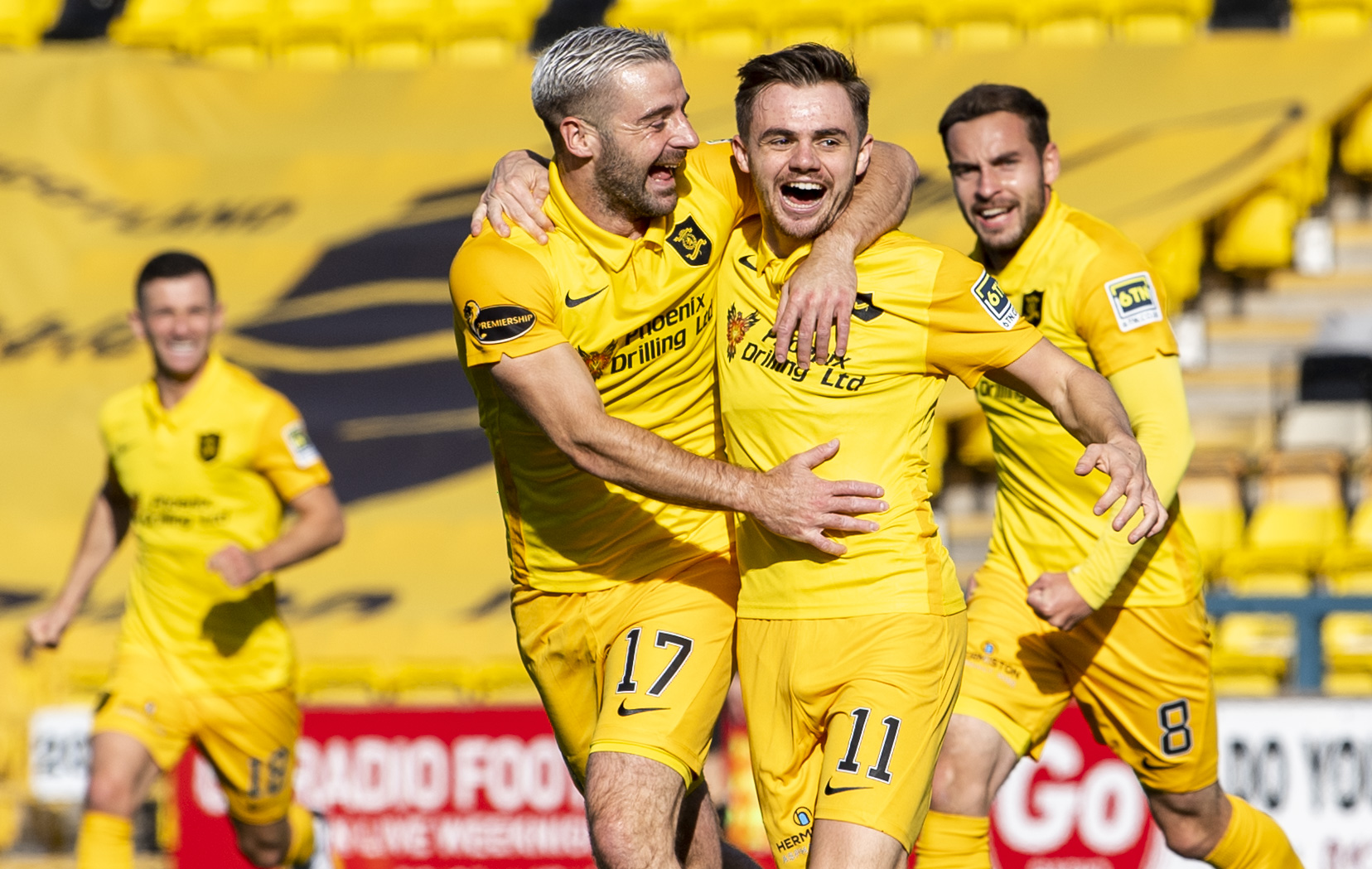 Livingston's Alan Forrest celebrates with Scott Robinson after scoring to make it 2-0 at The Tony Macaroni Arena. (Photo by Ross Parker / SNS Group)