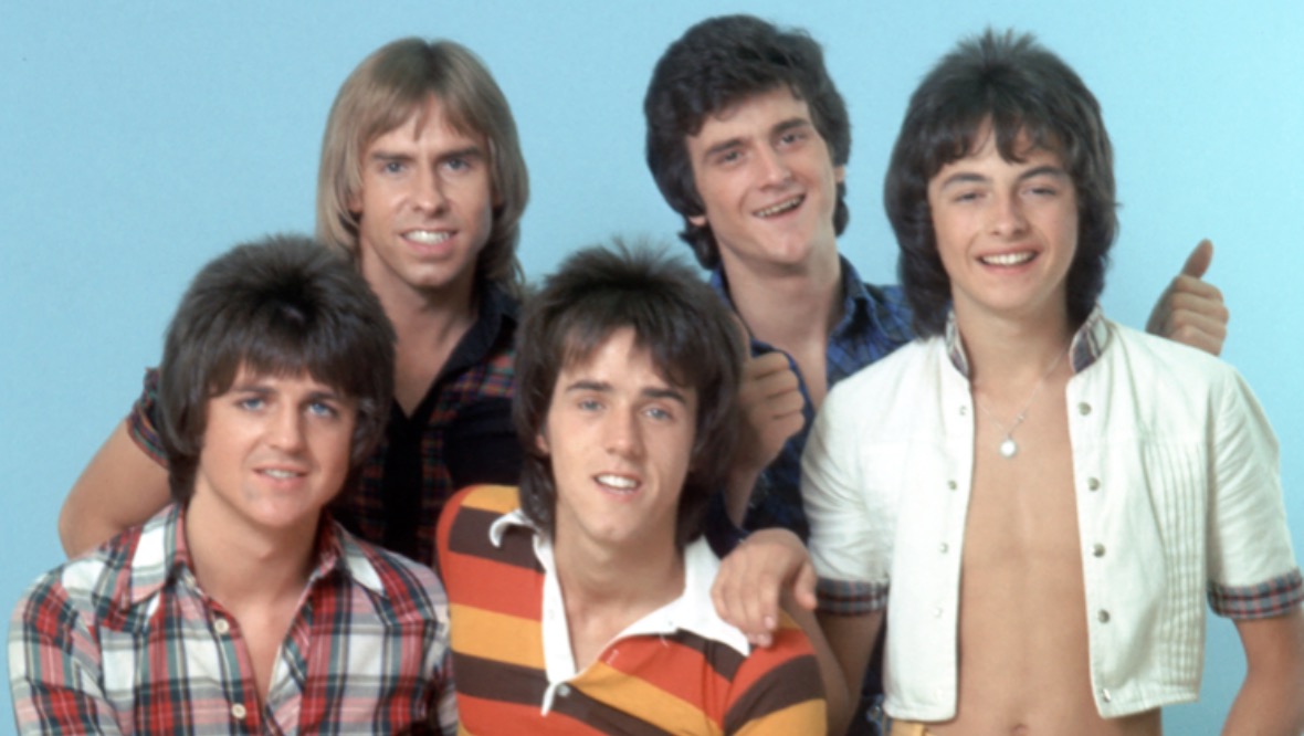 The Bay City Rollers pose for a portrait in December 1978 in Los Angeles, California. (L-R back) Derek Longmuir, Leslie Mckeown and Ian Mitchell, (L-R front) Eric Faulkner and Stuart 'Woody' Wood. 
