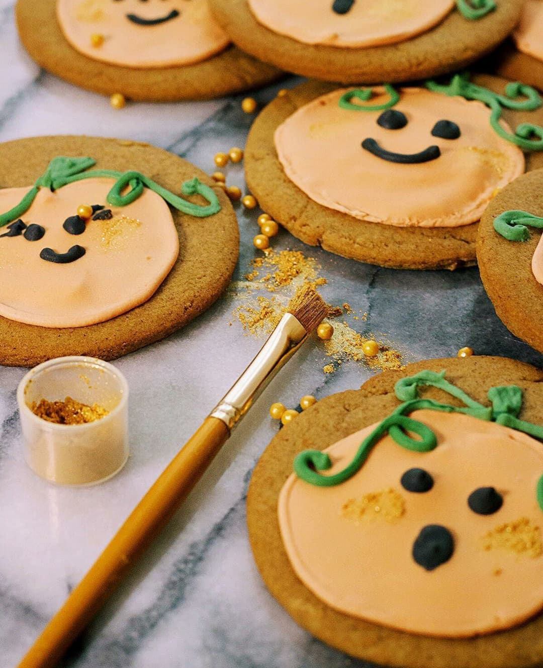 Pumpkin themed gingerbread biscuits.