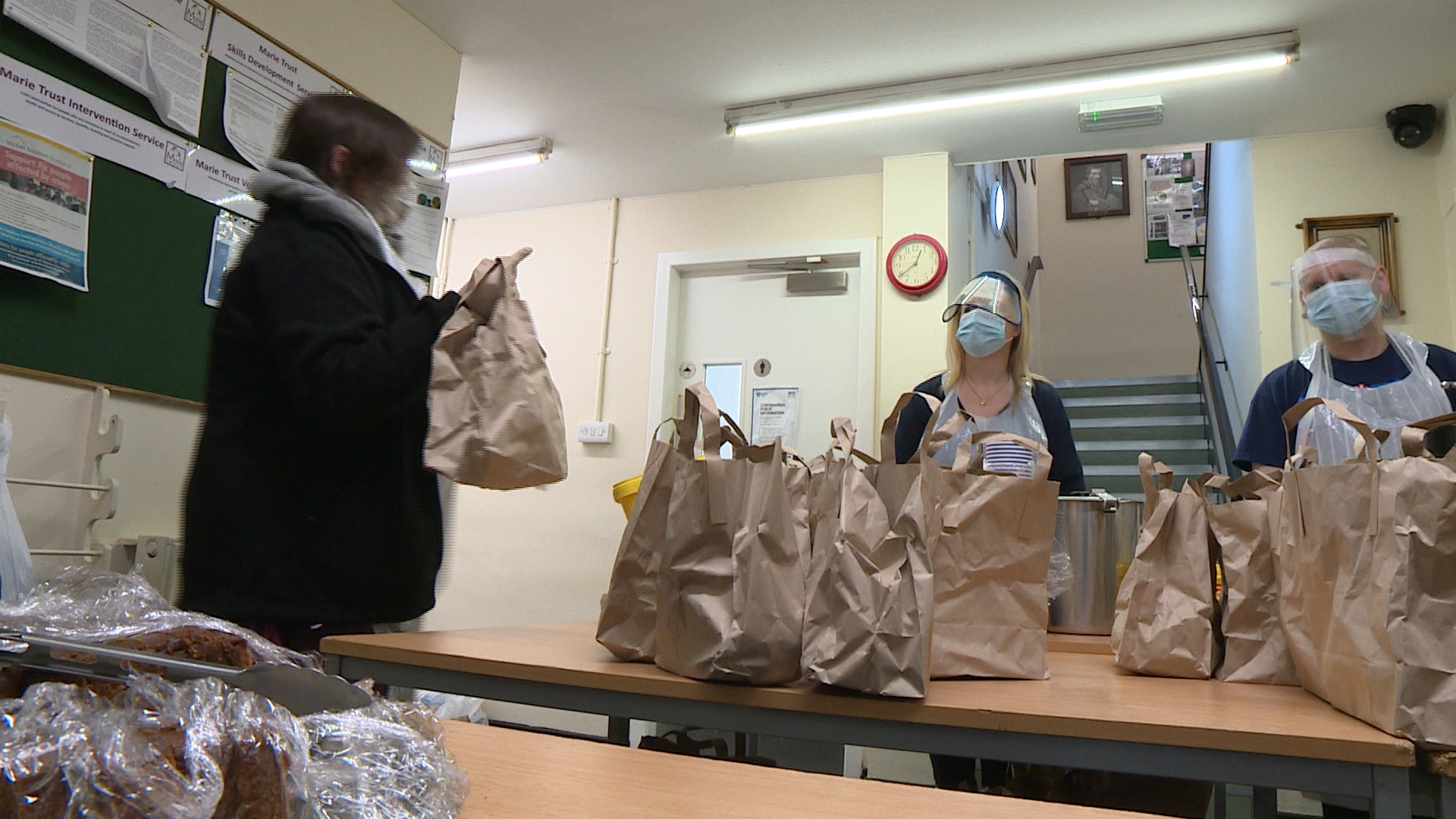 Volunteers assemble meal packs to hand out in Glasgow.